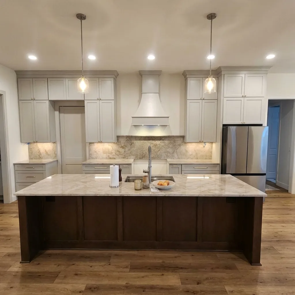Luxury kitchen interior designed by Mayan Design Studio showing a symmetrical cabinet layout and integrated range hood.