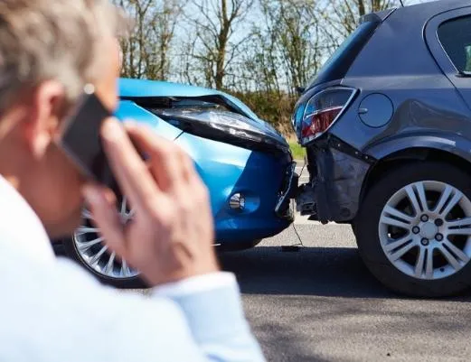 Man calling after a minor two-car collision in Florida; consult a Board Certified Civil Trial Specialist at The Mitchell Law Firm for expert guidance on accident claims.