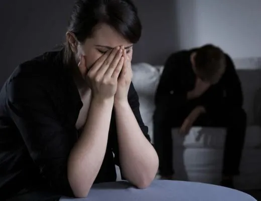 A grieving woman with her face in her hands, illustrating the emotional weight of wrongful death cases litigated by Board Certified Specialist Joe Mitchell in Florida.