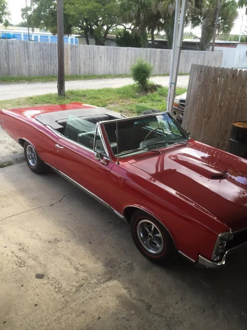Classic red muscle car interior and convertible top restoration performed by AE Auto Upholstery in Melbourne, Florida.
