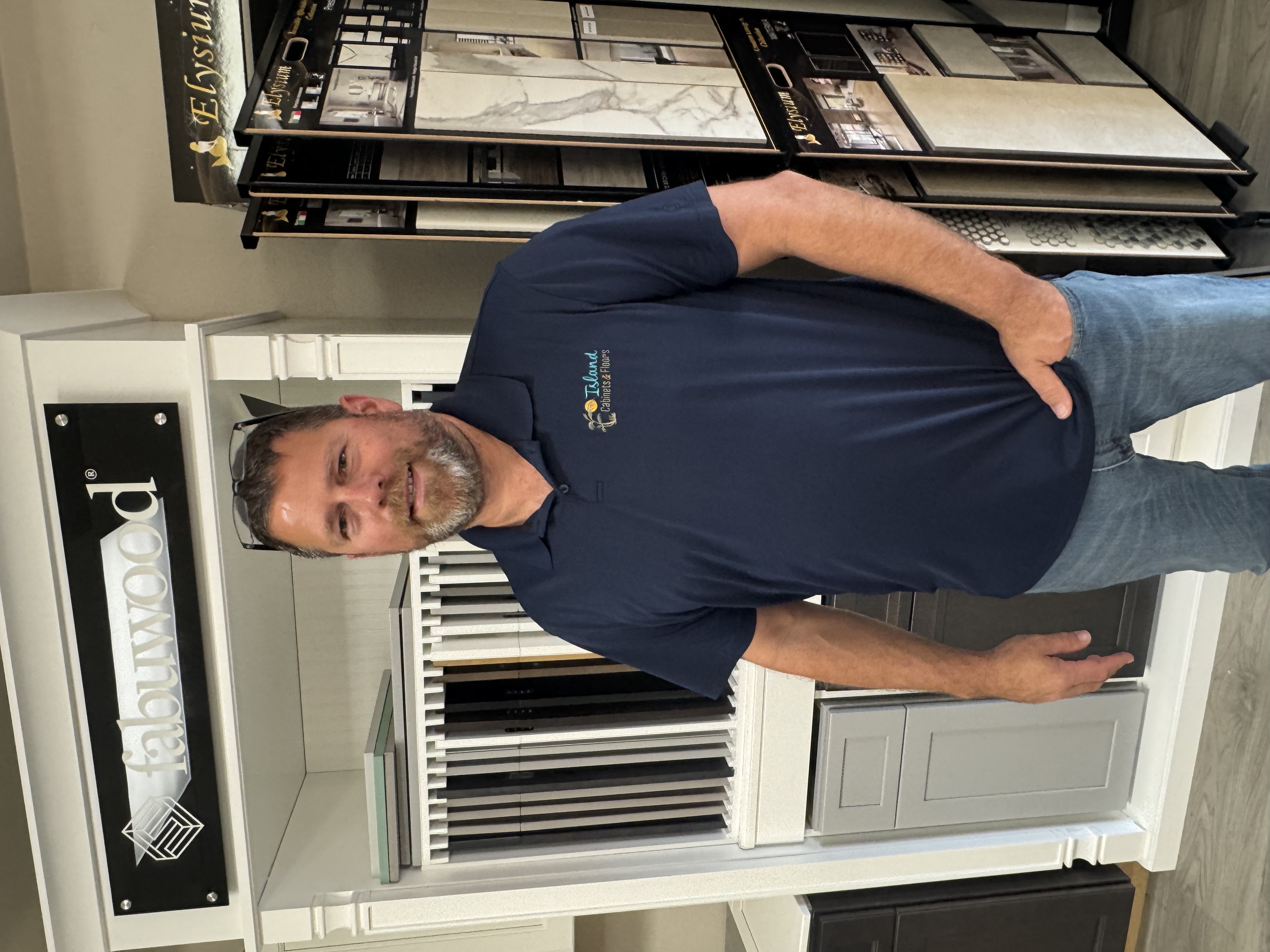 Owner of Island Cabinets & Floors in the showroom.